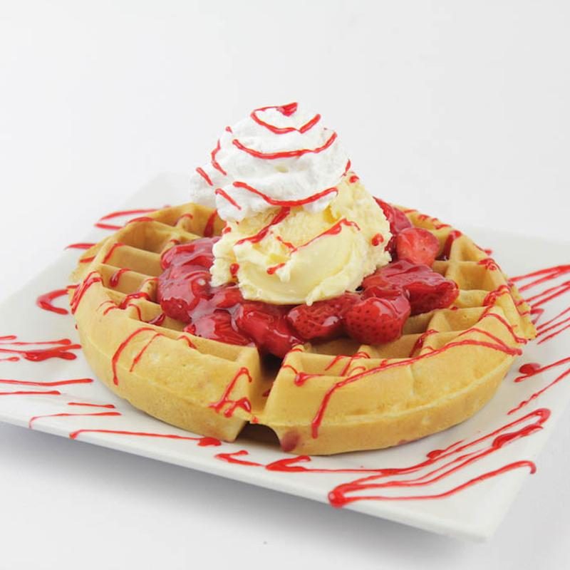 Waffle with strawberries and ice cream